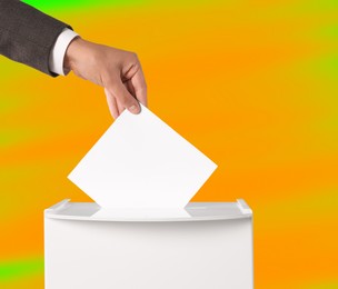 Image of Man putting his vote into ballot box on color background, closeup