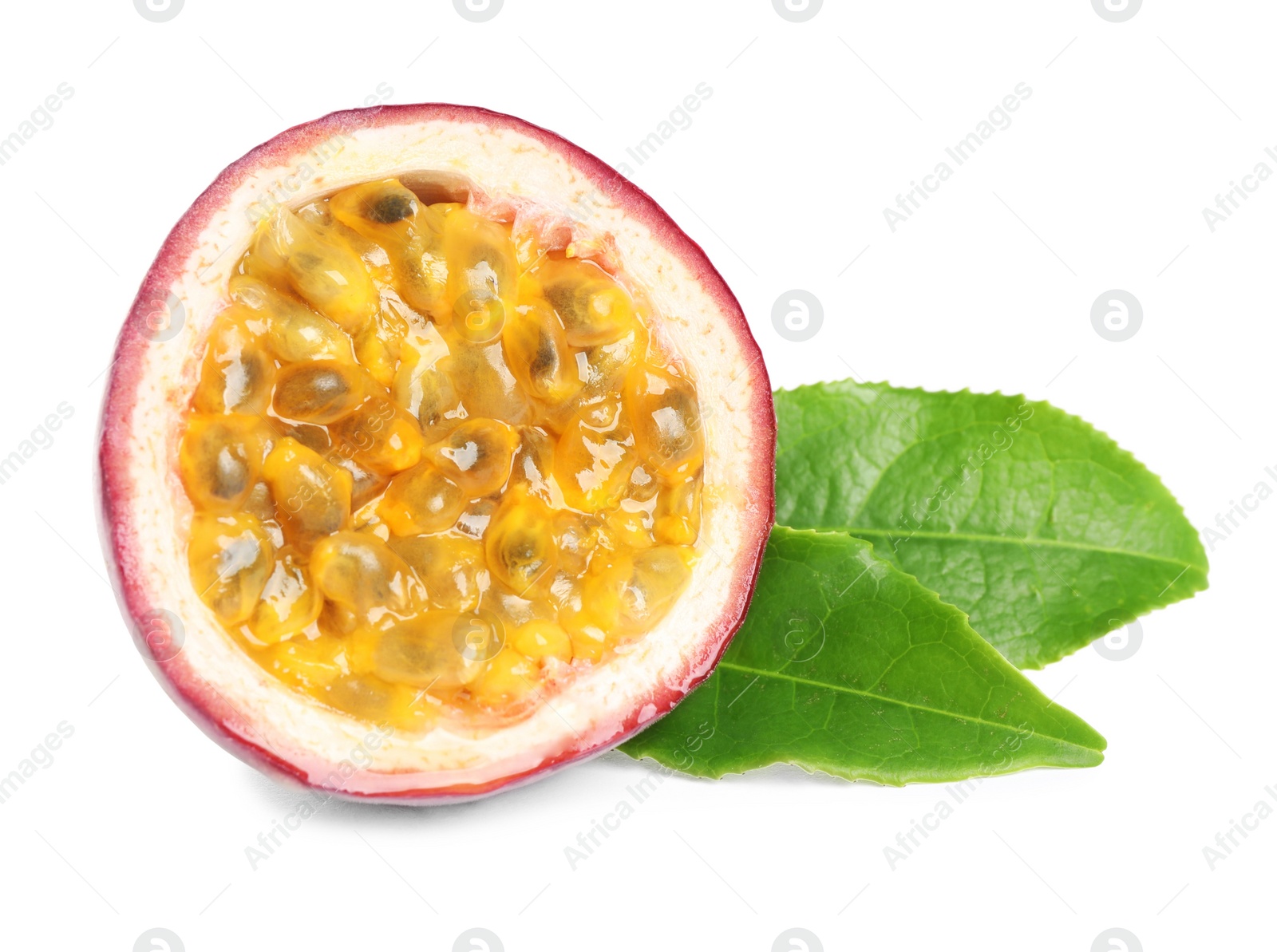 Photo of Half of fresh ripe passion fruit (maracuya) with green leaves isolated on white
