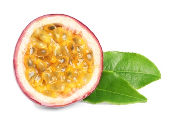 Photo of Half of fresh ripe passion fruit (maracuya) with green leaves isolated on white