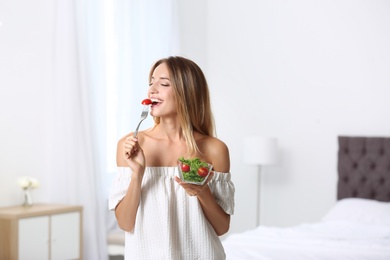 Photo of Happy slim woman with salad at home. Weight loss diet