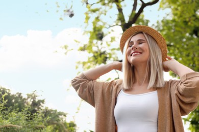 Photo of Portrait of beautiful woman in straw hat outdoors on sunny day