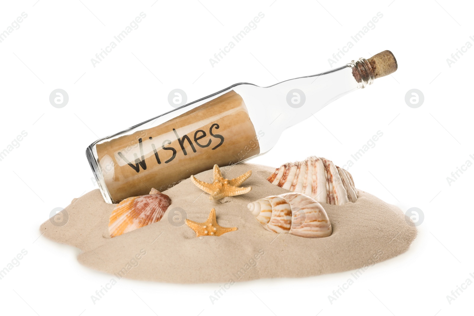 Photo of Corked glass bottle with Wishes note and seashells on sand against white background