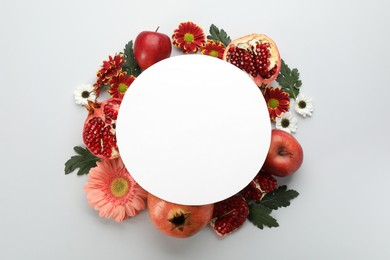 Photo of Flat lay composition with Rosh Hashanah holiday attributes and card on white background. Space for text