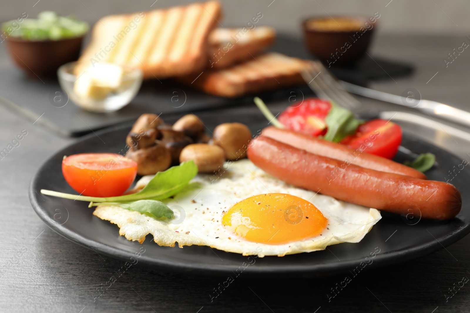 Photo of Tasty breakfast with fried egg on table, closeup