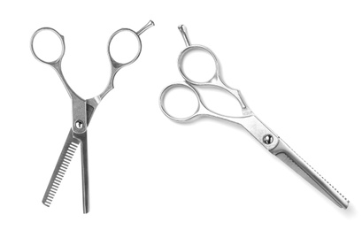 Image of New thinning scissors on white background. Professional hairdresser tool