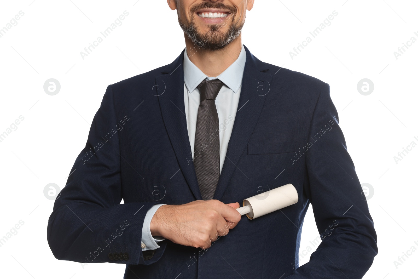 Photo of Man cleaning jacket with adhesive lint roller on white background, closeup