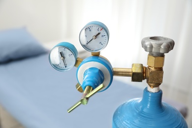 Photo of Medical oxygen tank in hospital room, closeup