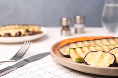 Photo of Delicious grilled vegetables served on table, closeup. Space for text