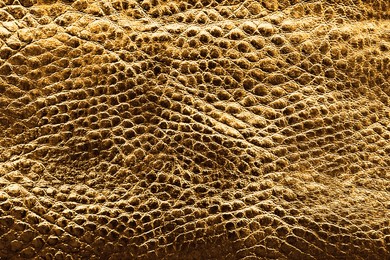 Image of Golden textured surface as background, closeup view