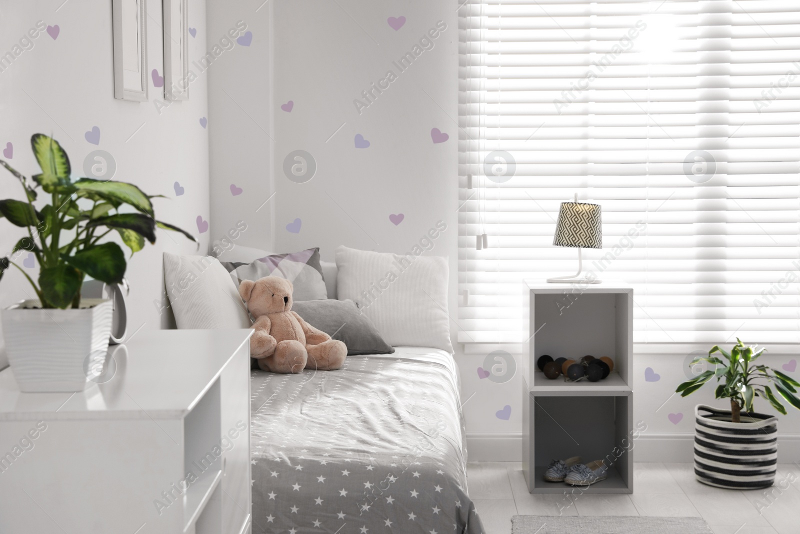 Image of Modern child room interior with comfortable bed near window 