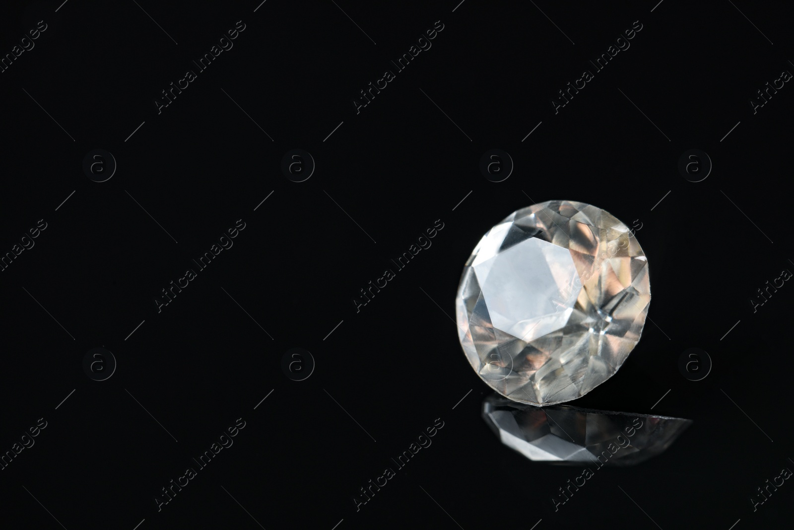 Photo of Beautiful gemstone for jewelry on black background. Space for text