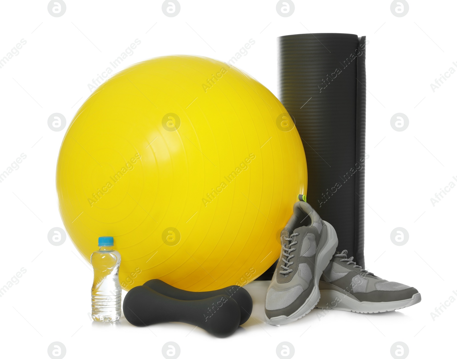 Photo of Fitness ball, bottle of water and sport accessories isolated on white