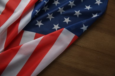 Photo of Flag of USA on wooden table, top view