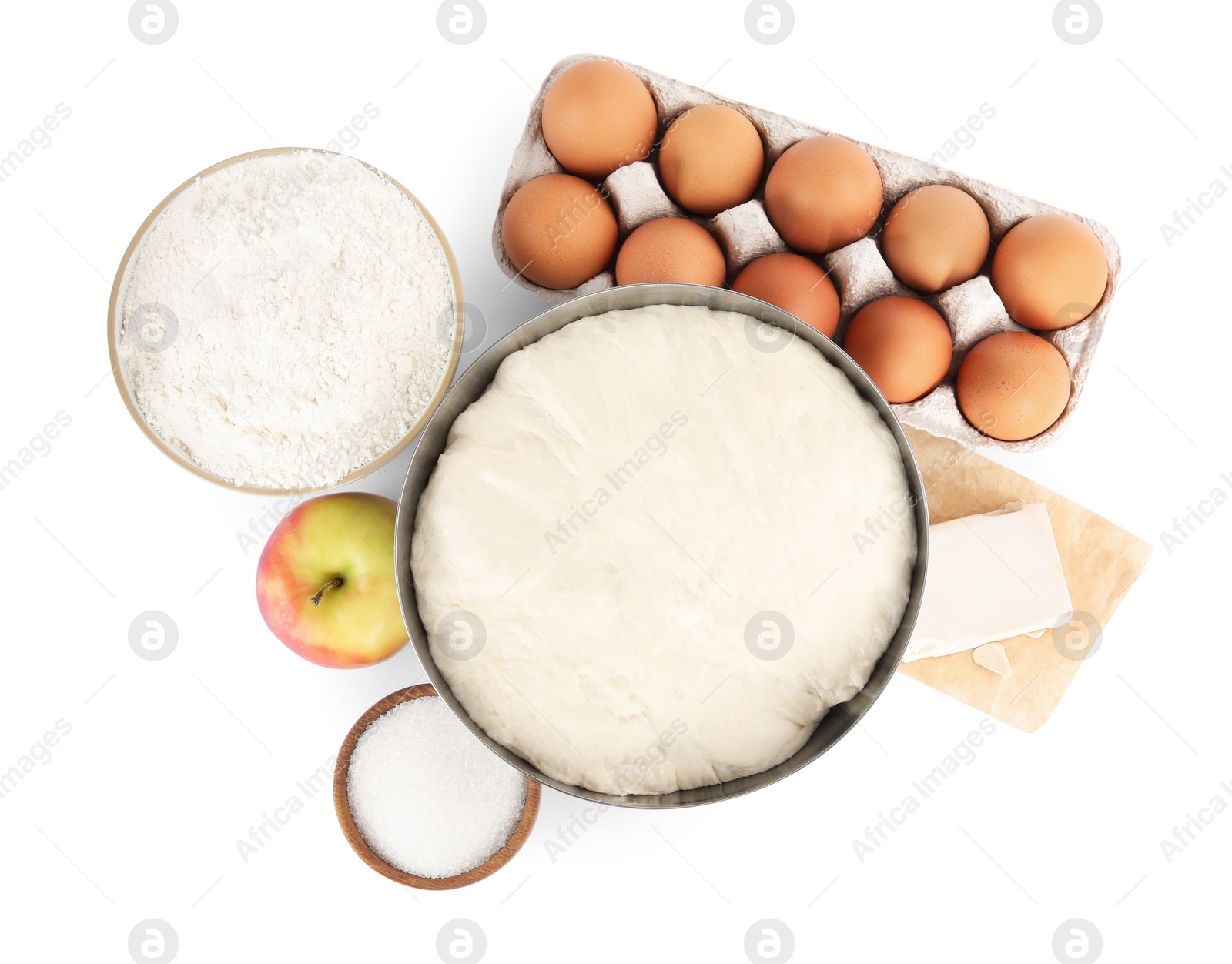 Photo of Fresh yeast dough and ingredients for cake on white background, top view