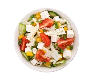 Tasty salad with Chinese cabbage, tomato, cheese, pepper and cucumber in bowl isolated on white, top view