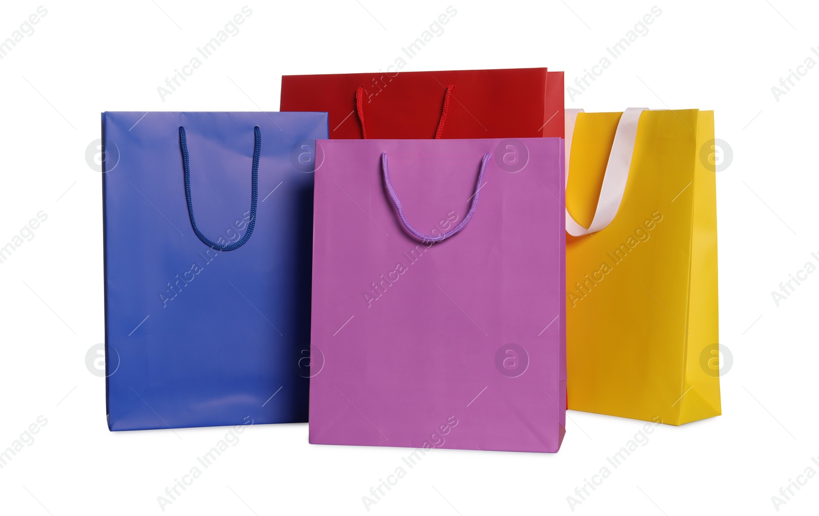 Photo of Colorful paper shopping bags isolated on white