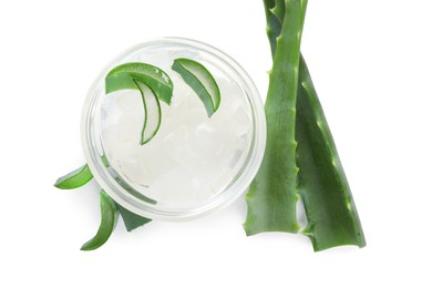 Photo of Peeled aloe vera in bowl and pieces of green plant isolated on white, top view