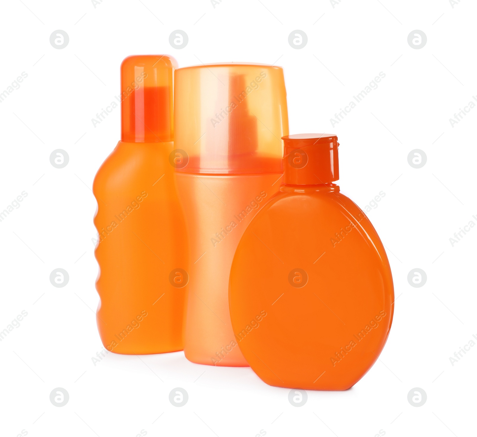 Photo of Bottles with sun protection products isolated on white