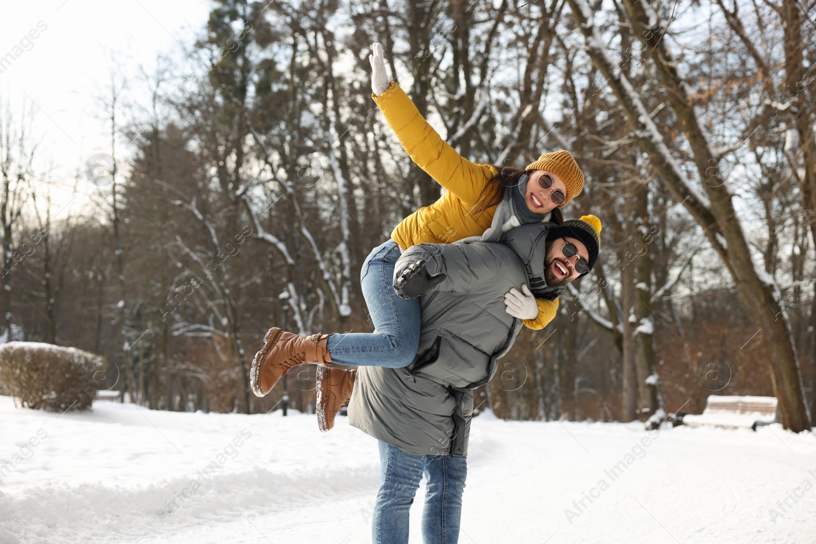 Photo of Happy young couple having fun outdoors on winter day