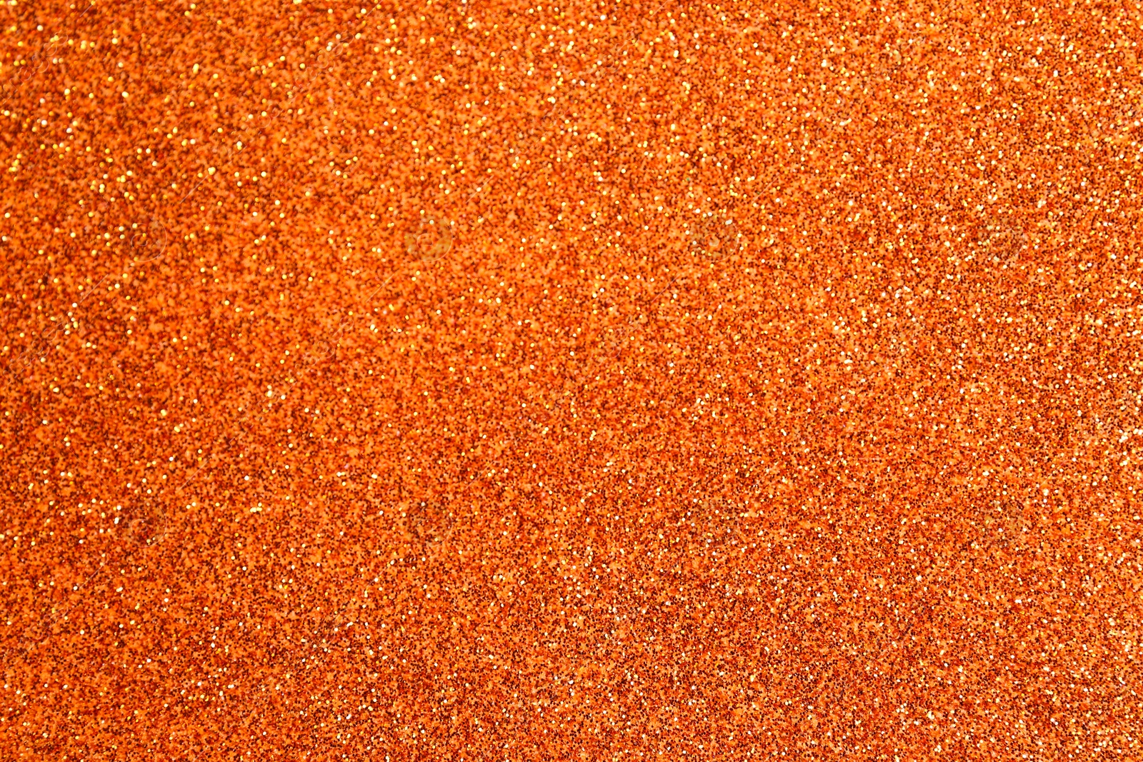 Photo of Orange textured surface as background, closeup view