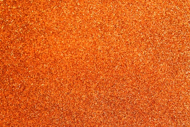 Photo of Orange textured surface as background, closeup view