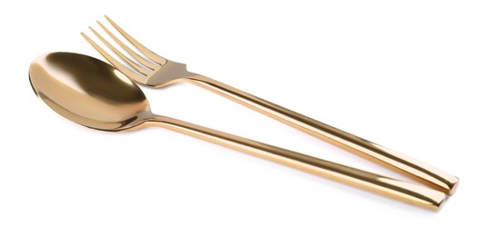 Photo of New shiny golden fork and spoon on white background