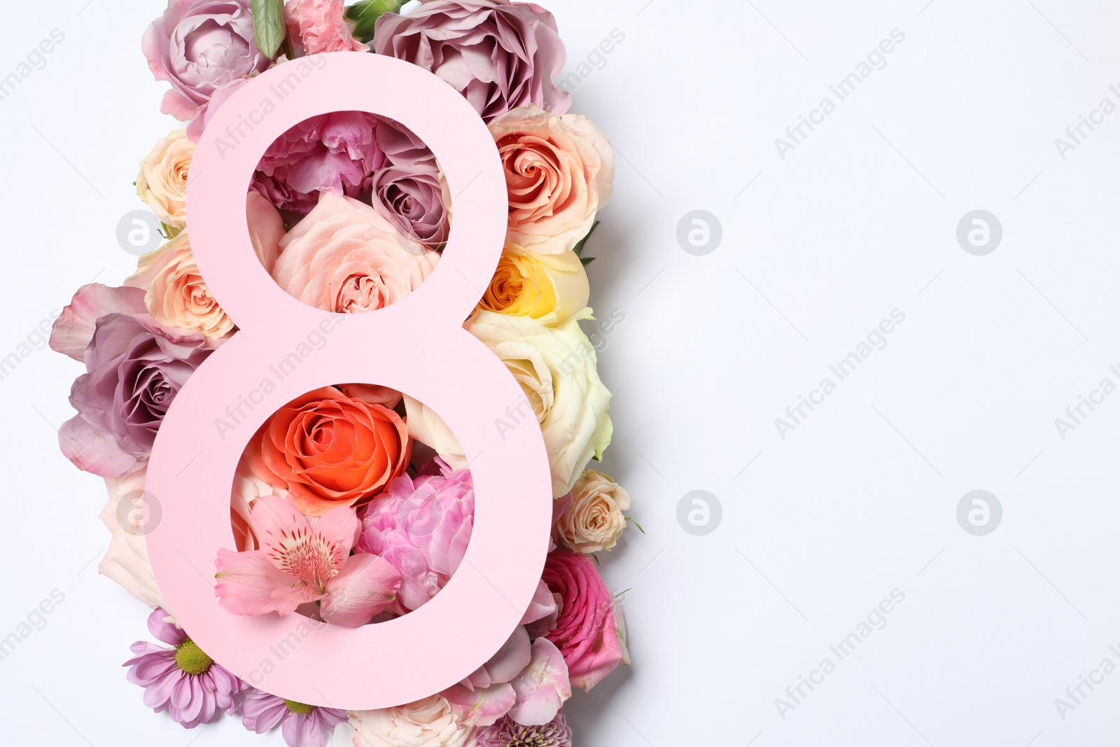 Photo of 8 March greeting card design with flowers on white background, top view. Happy International Women's Day