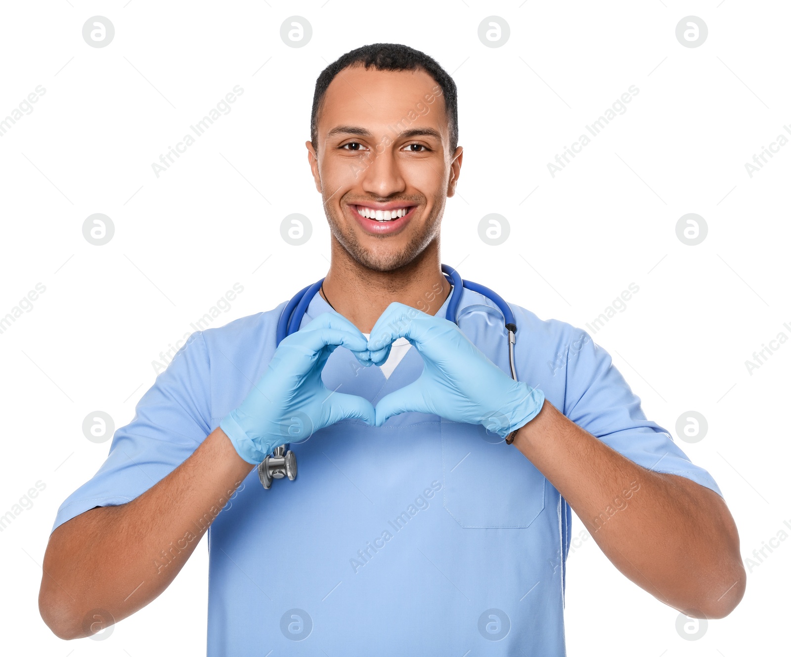 Photo of Doctor or medical assistant (male nurse) making heart with hands on white background