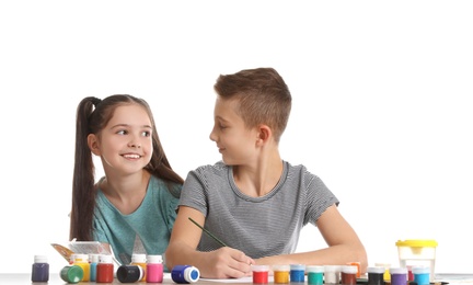 Photo of Cute children painting picture at table on white background
