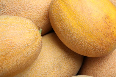 Photo of Whole tasty ripe melons as background, closeup