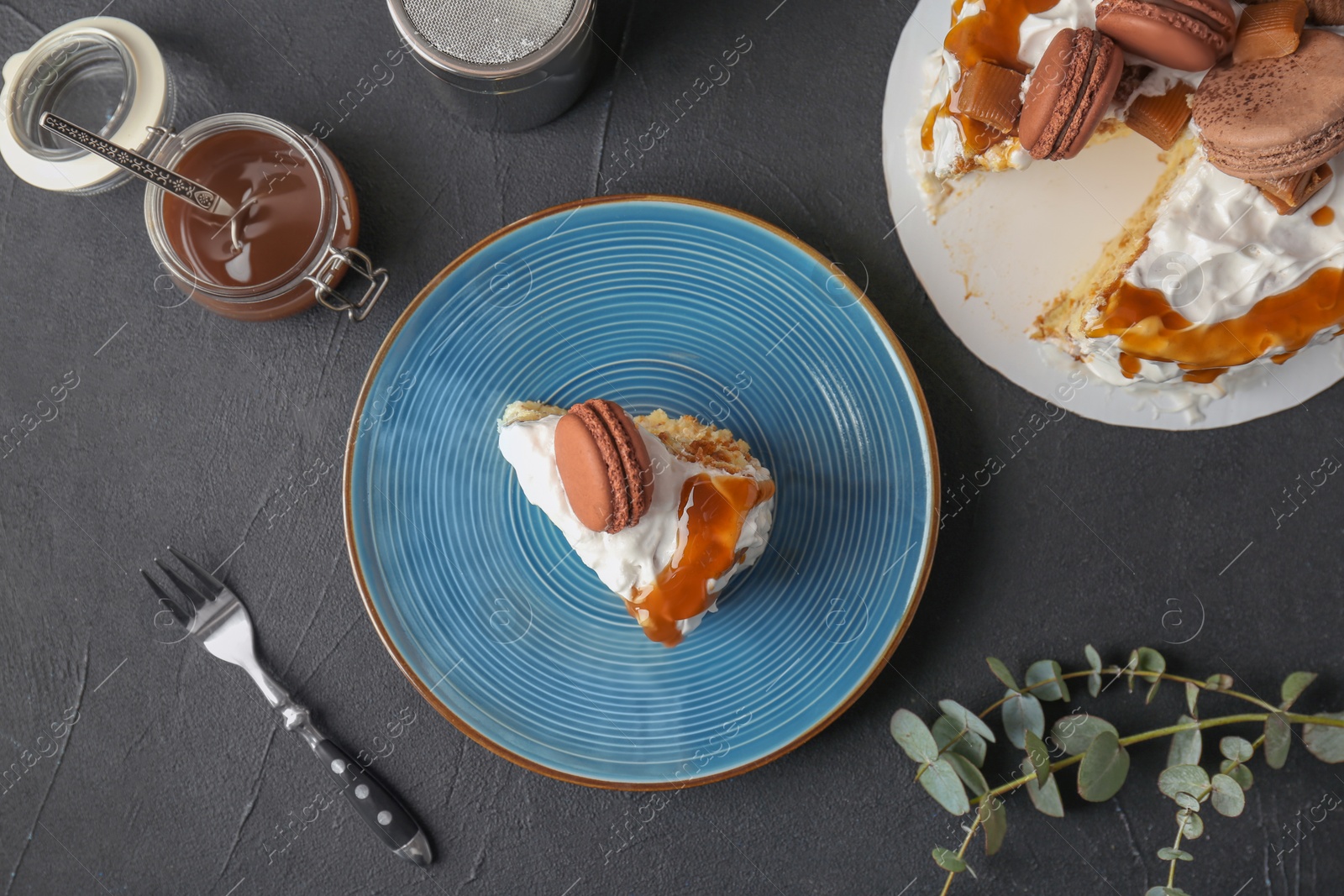 Photo of Delicious homemade cake with caramel sauce on table, top view