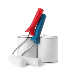 Photo of Paint cans and roller brushes on white background. Mockup for design