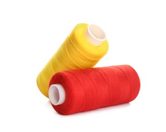 Different colorful sewing threads on white background