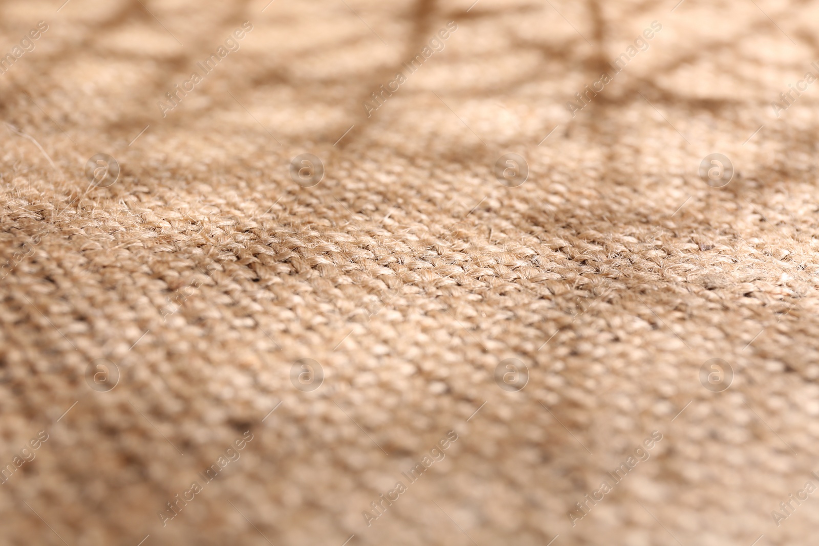 Photo of Texture of beige burlap fabric, closeup view