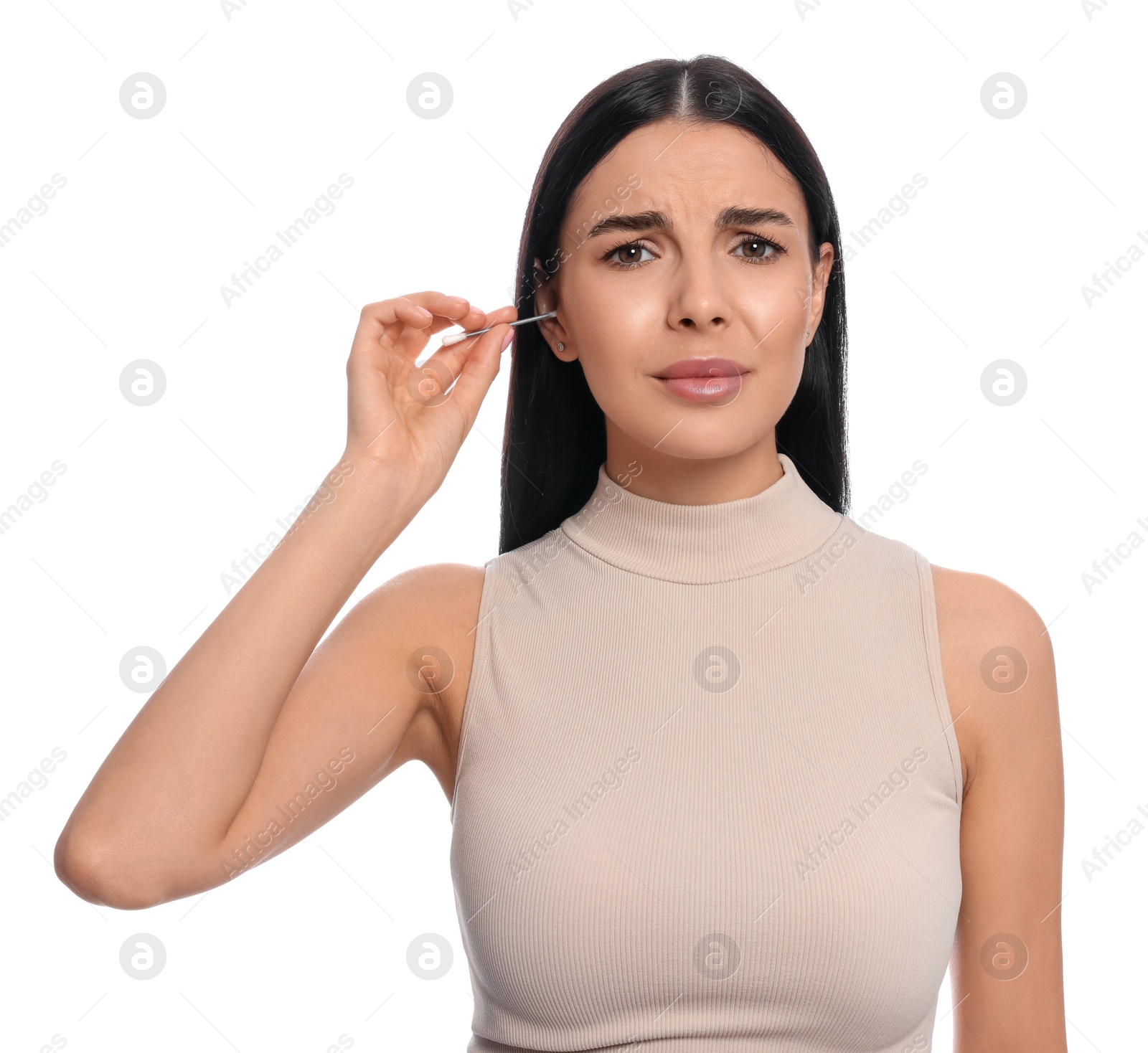 Photo of Young woman cleaning ear with cotton swab on white background