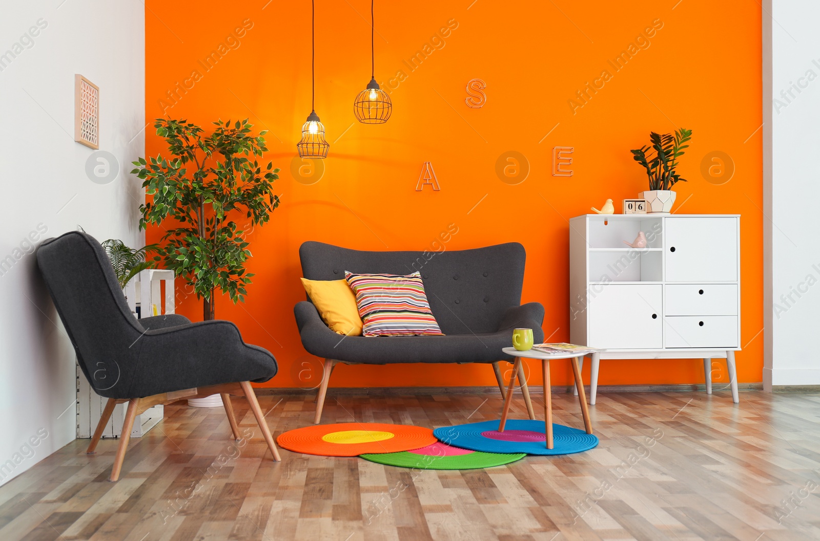 Photo of Interior of modern living room with pillows on sofa