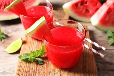 Photo of Summer watermelon drink served on wooden board