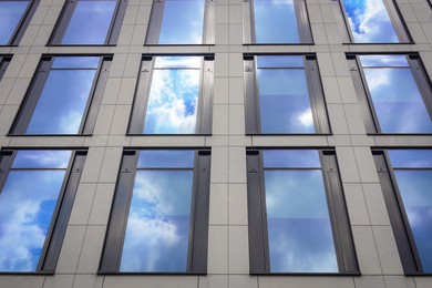 Modern building with tined windows, low angle view