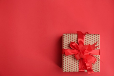 Photo of Beautifully decorated gift box on color background, top view
