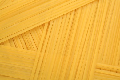Photo of Raw spaghetti pasta as background, top view