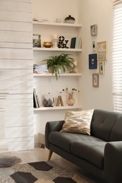 Photo of Cozy living room interior with comfortable sofa near window