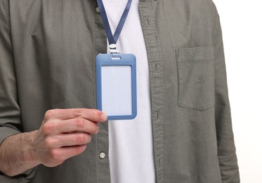 Photo of Man showing empty badge on white background, closeup