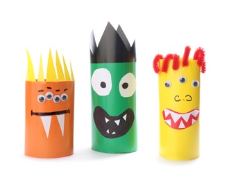Photo of Funny monsters on white background. Halloween decoration
