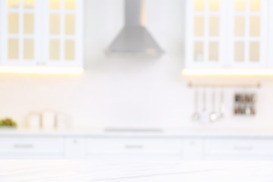 Photo of Blurred view of modern kitchen interior with stylish furniture