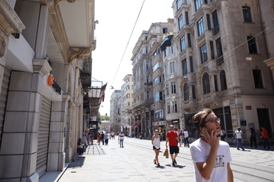 Photo of ISTANBUL, TURKEY - AUGUST 10, 2019: Beautiful city street with people on sunny day