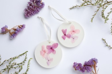 Photo of Composition with scented sachets on white background, top view
