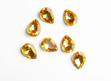 Image of Beautiful gemstones on white background, top view