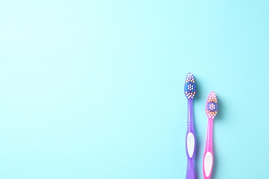 Photo of Manual toothbrushes on color background. Dental care