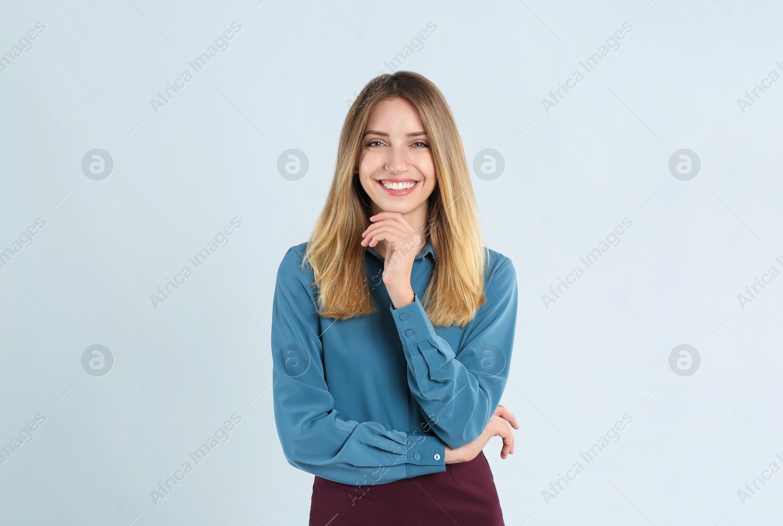 Photo of Portrait of beautiful young businesswoman on white background