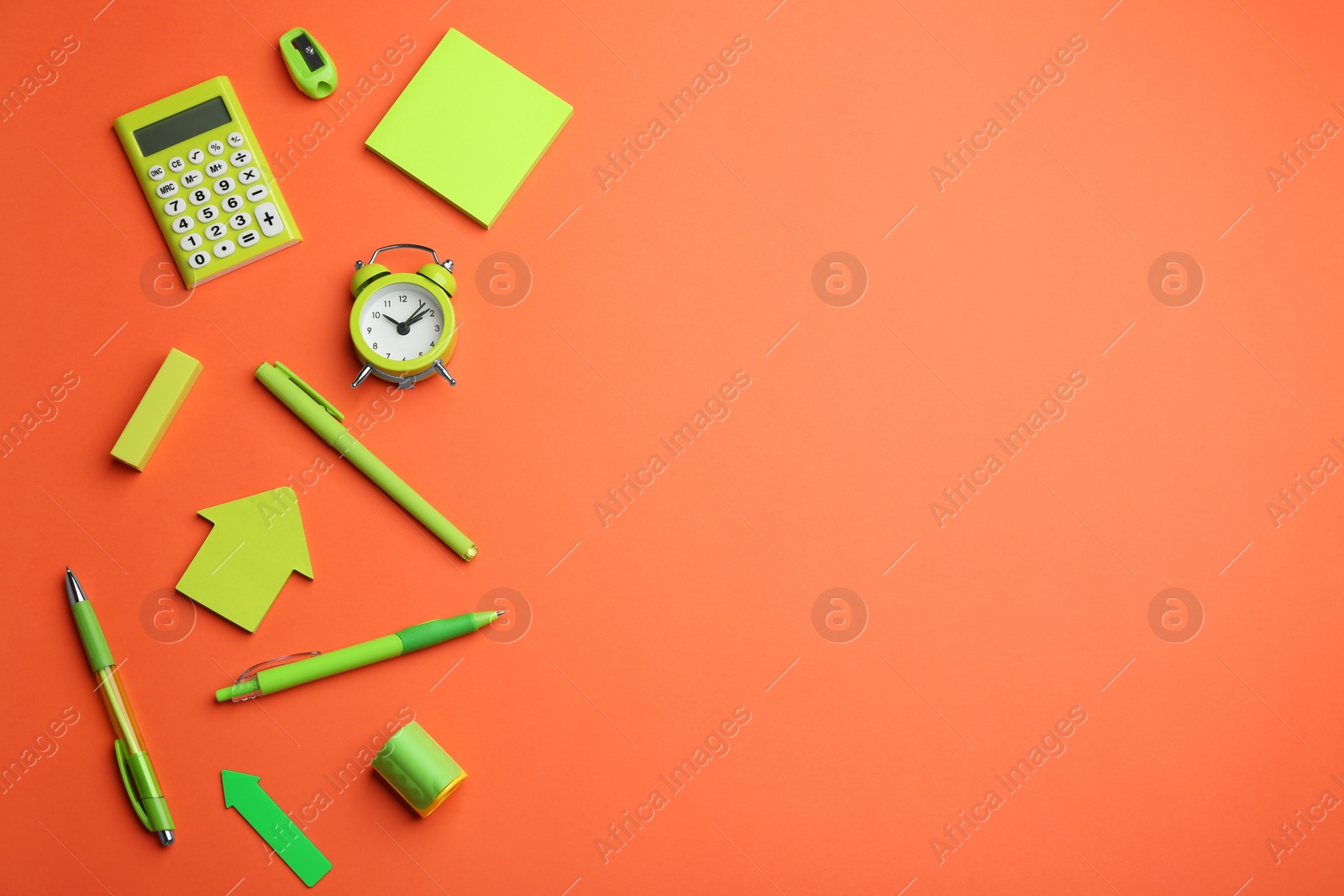 Photo of Different bright school stationery on coral background, flat lay. Space for text